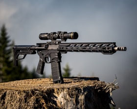 A high-tech thermal scope set against a dark forest background.