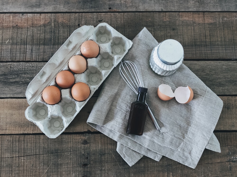 egg on white ceramic plate beside fork and knife