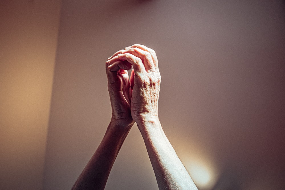 persons left hand on brown surface