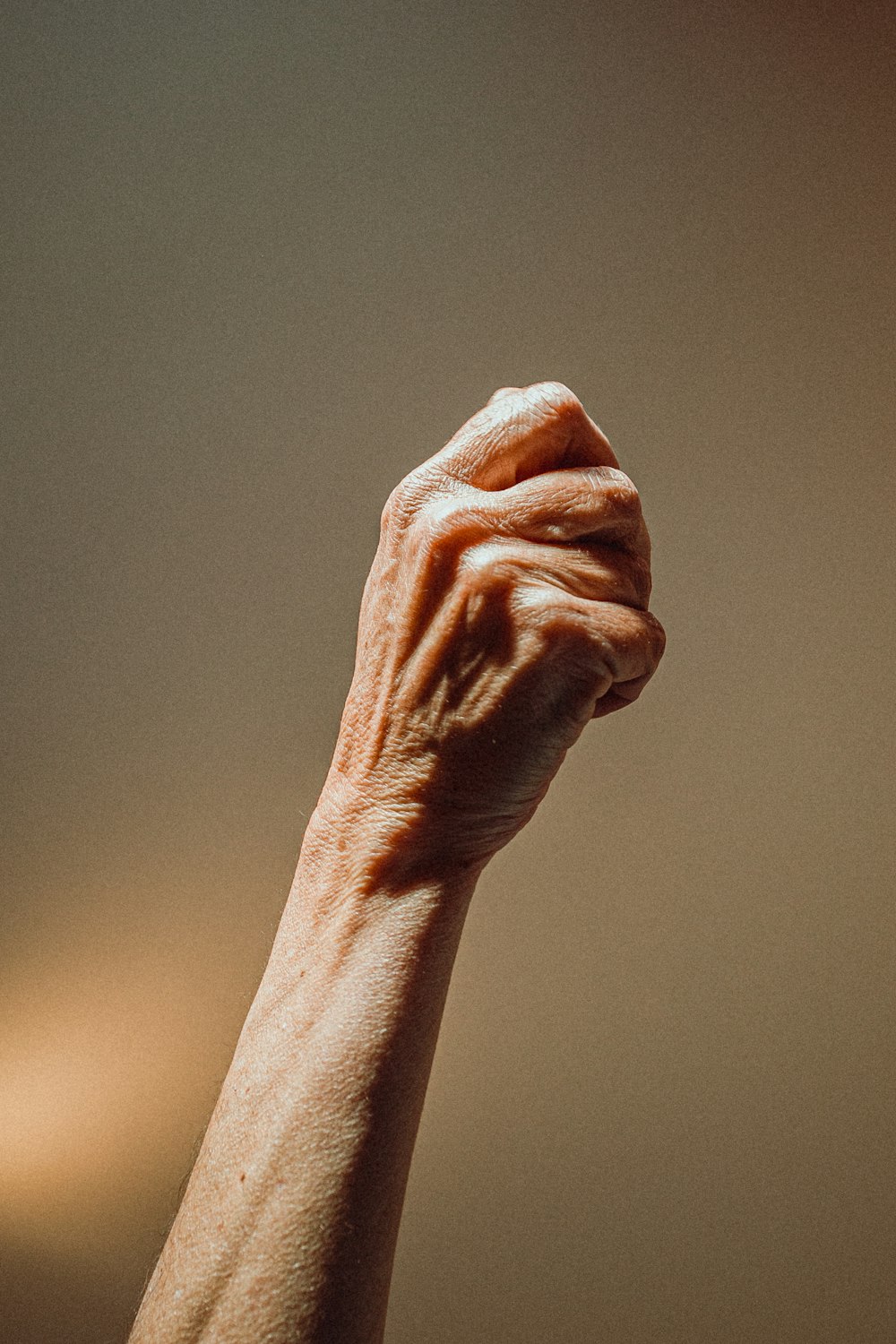 persons left hand on gray surface