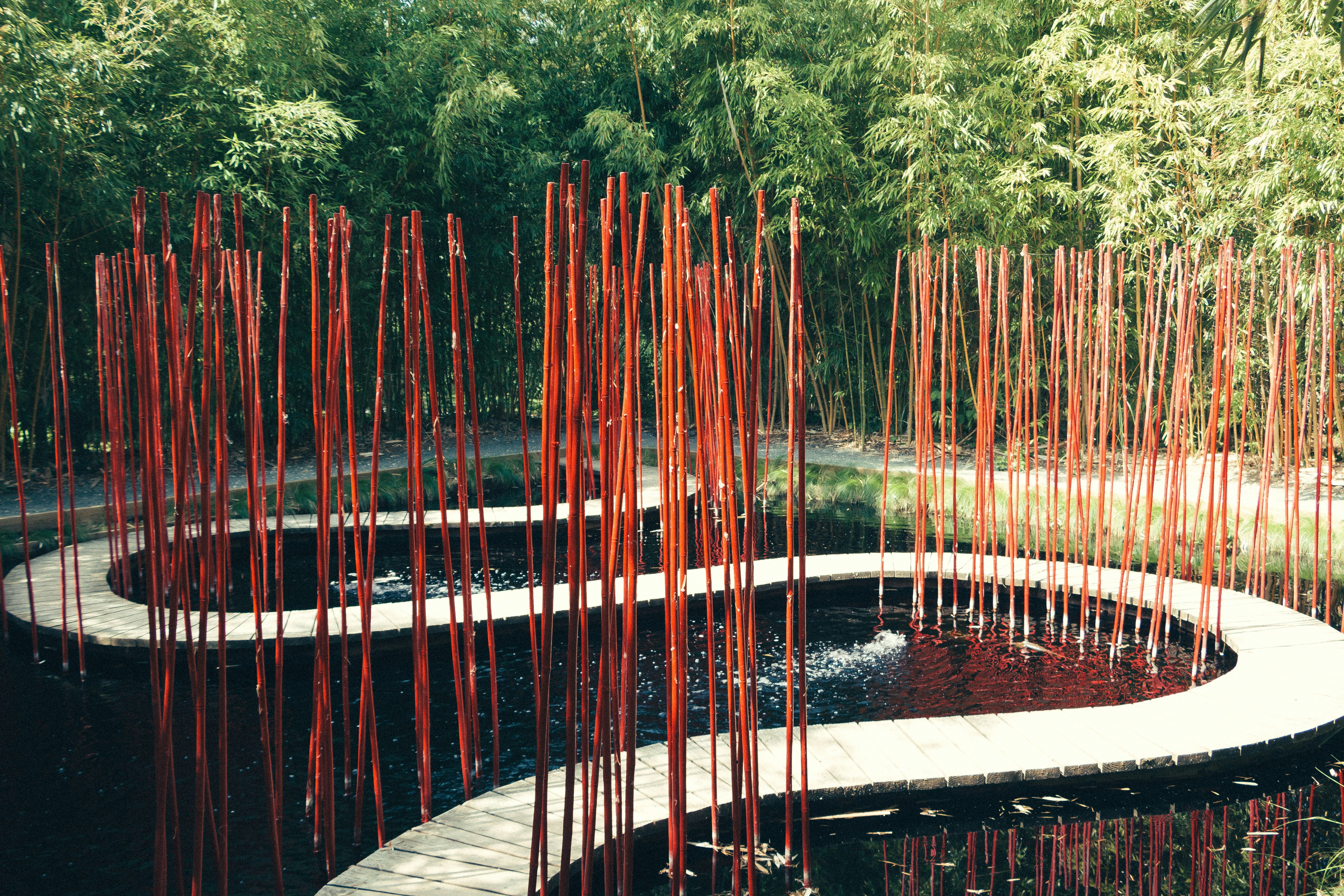 red metal bridge over river, Jardin contemporain chinois