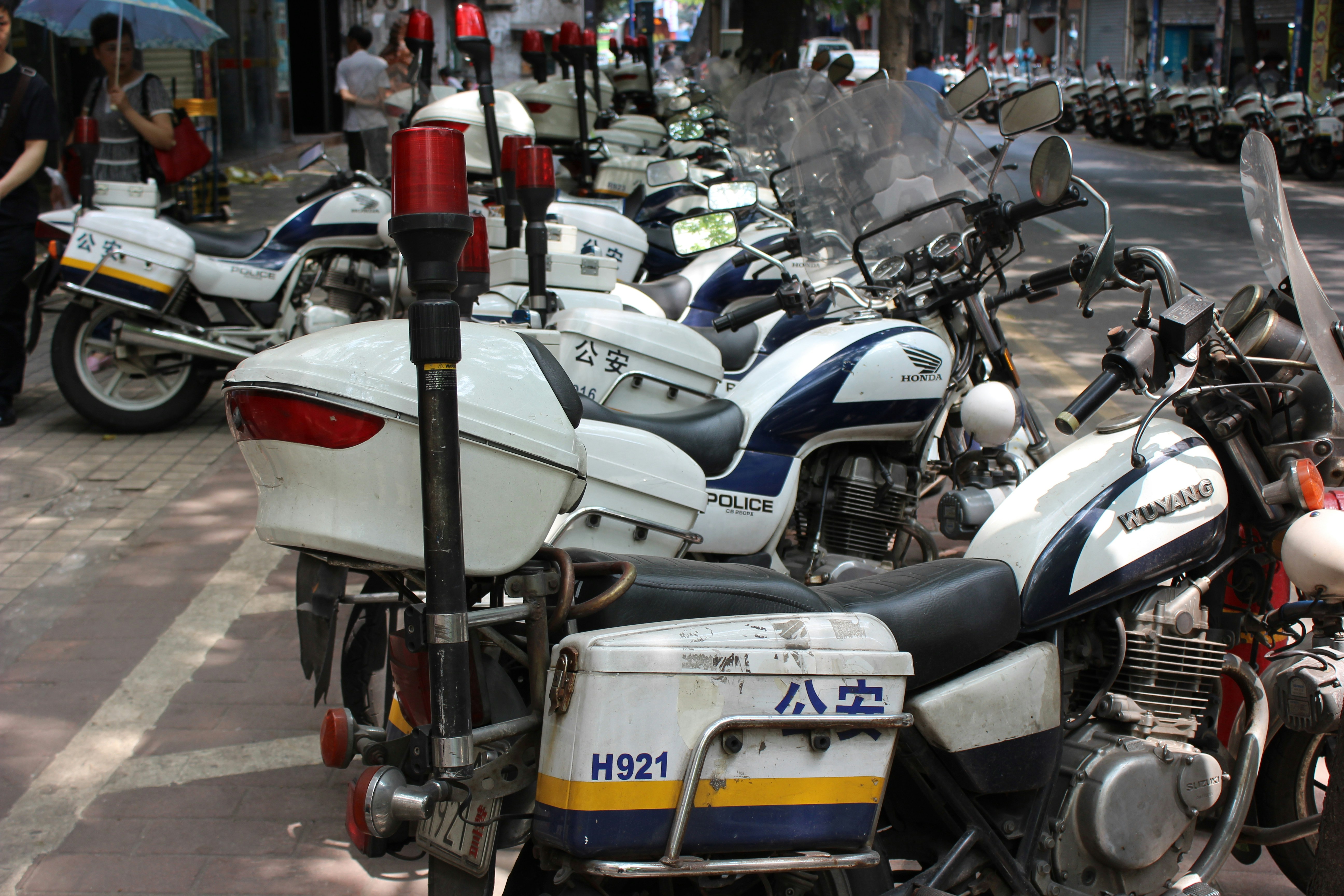 white and black motorcycle on street during daytime