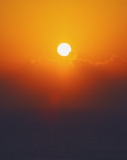 body of water during sunset