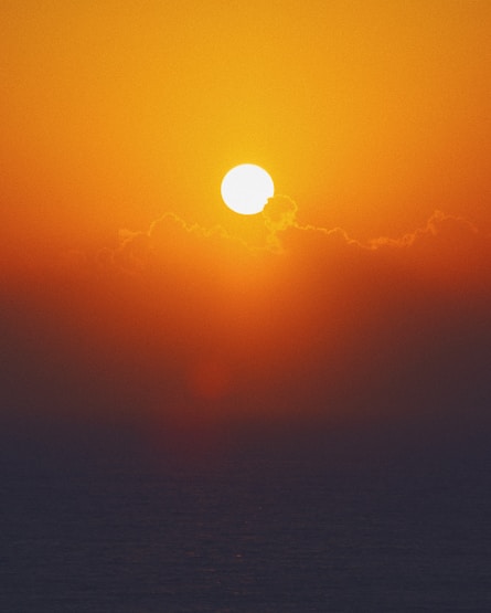 body of water during sunset