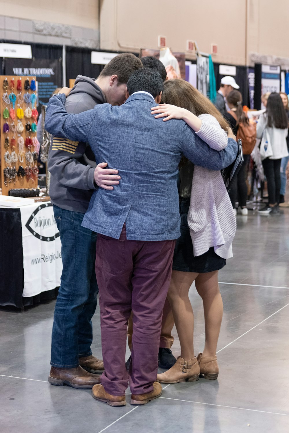 man in blue denim jacket and woman in gray sweater