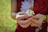 person holding white daisy flower