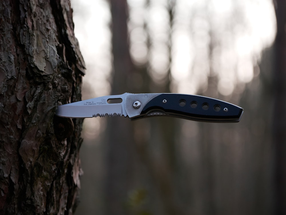 black and silver folding knife