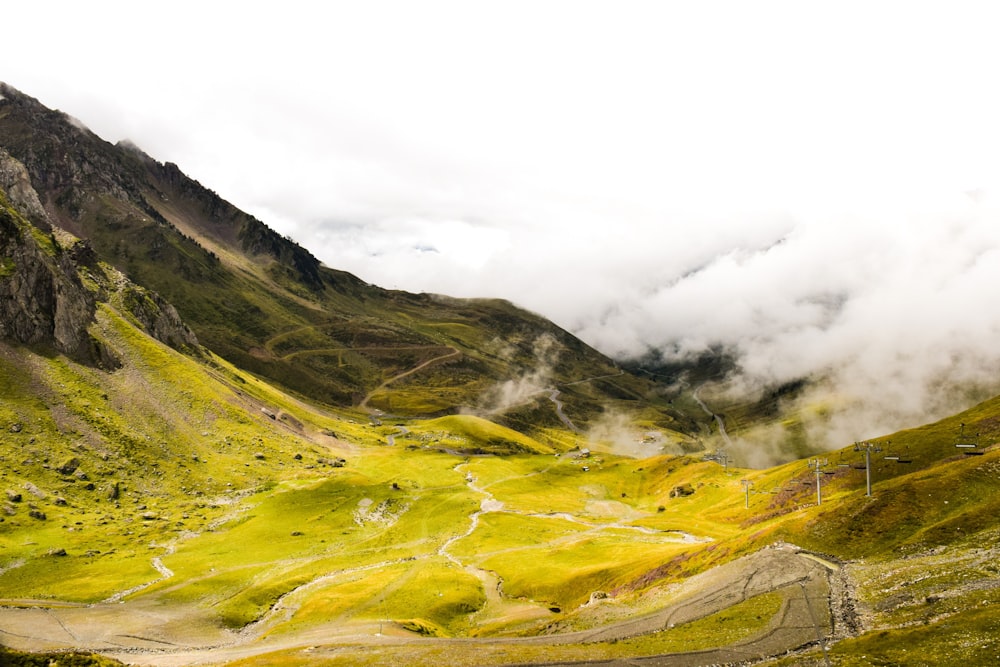 green mountains under white clouds during daytime