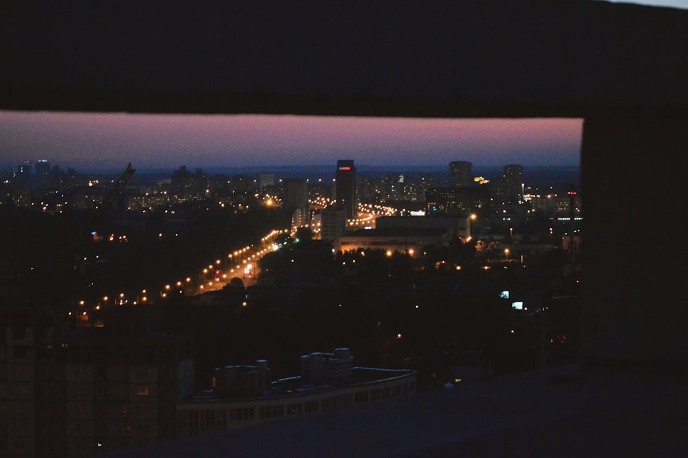 city with high rise buildings during night time