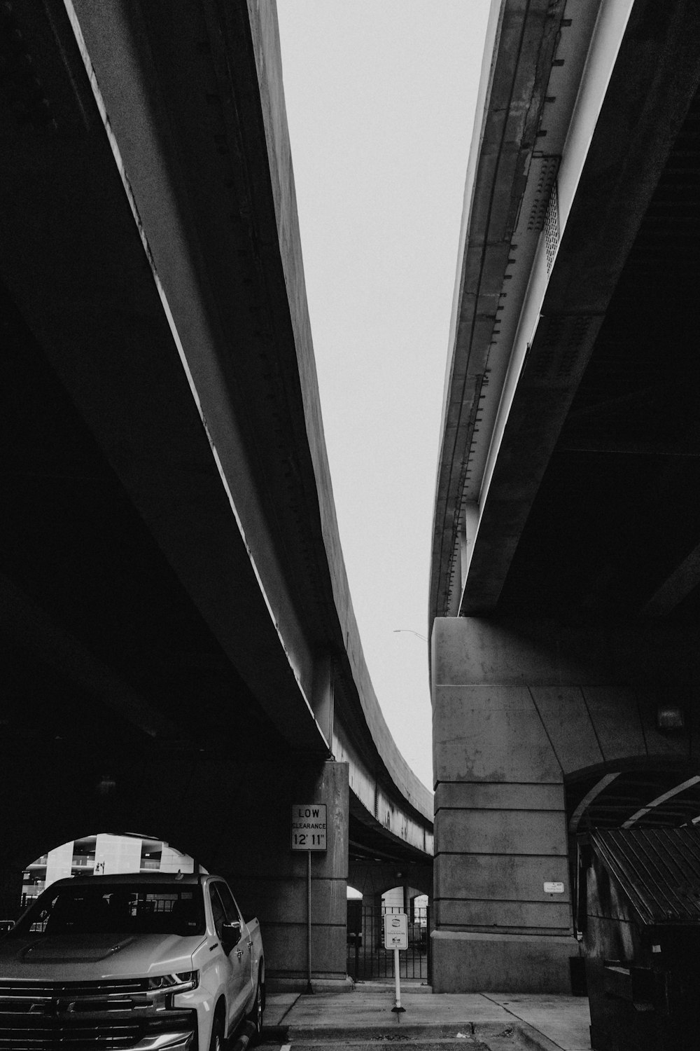 grayscale photo of a bridge