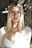 woman in white shirt smiling