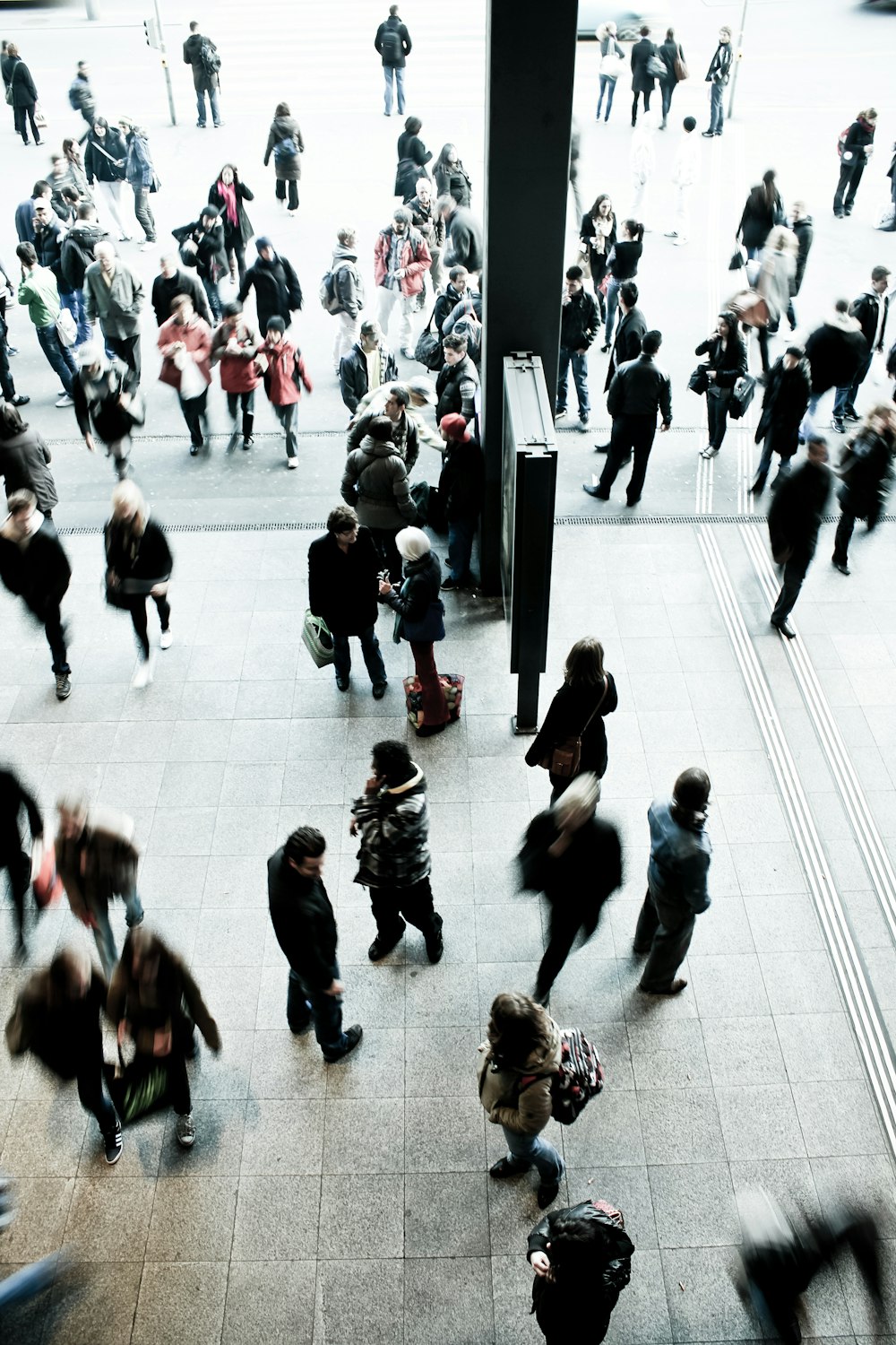 people walking on gray concrete floor