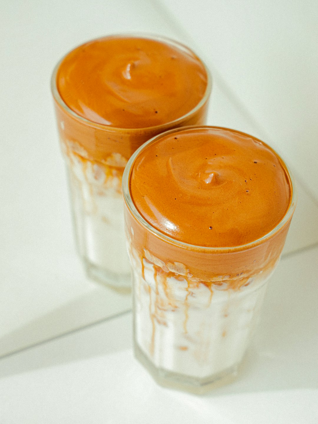 clear drinking glass with brown liquid