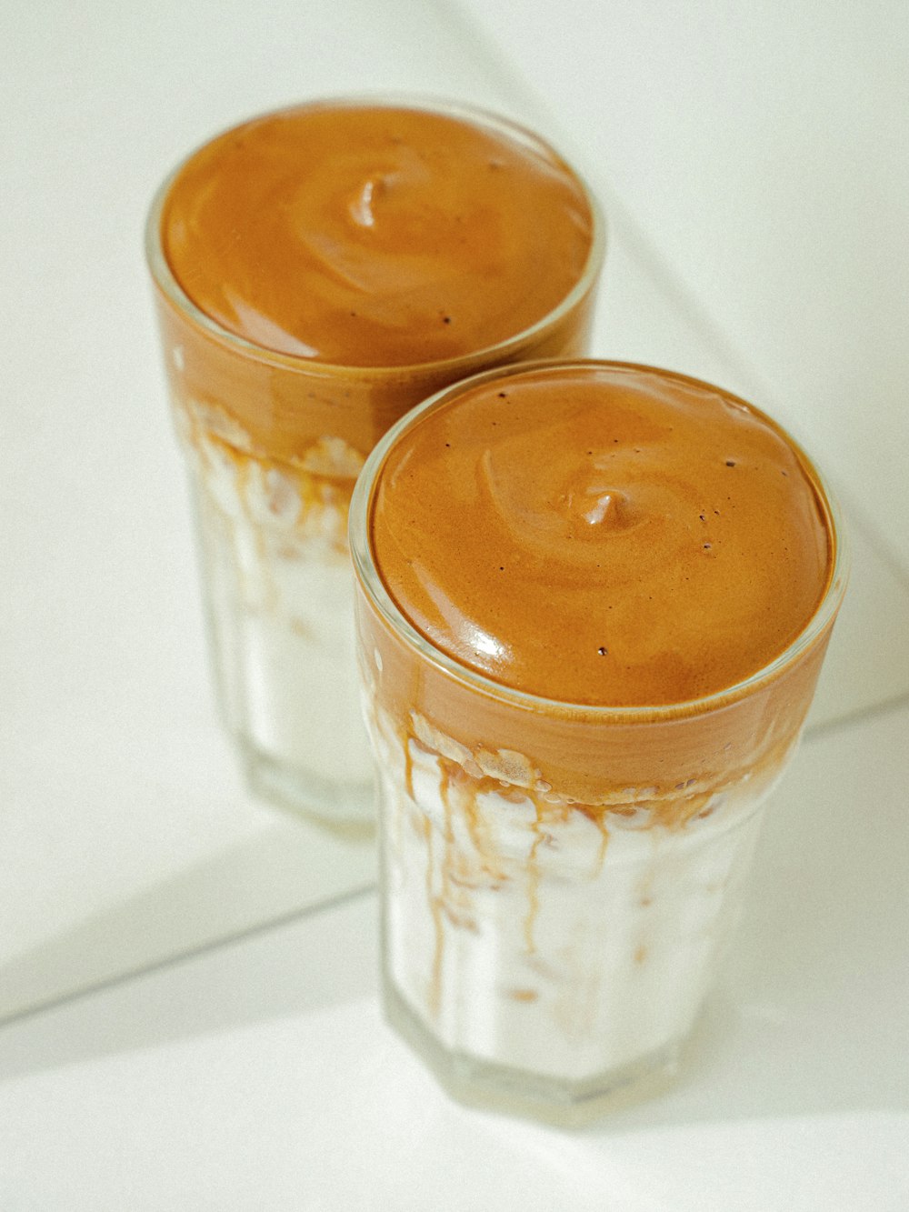 clear drinking glass with brown liquid