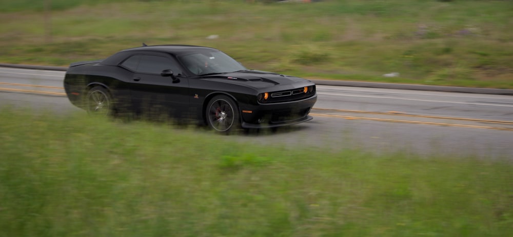 black porsche 911 on road during daytime