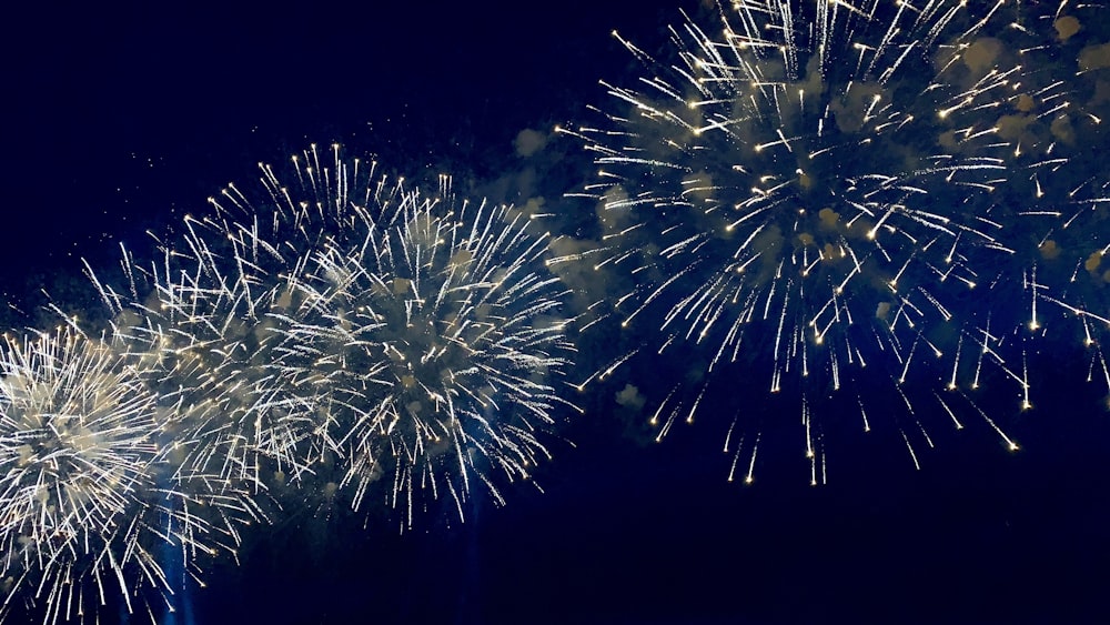 white and brown fireworks in the sky