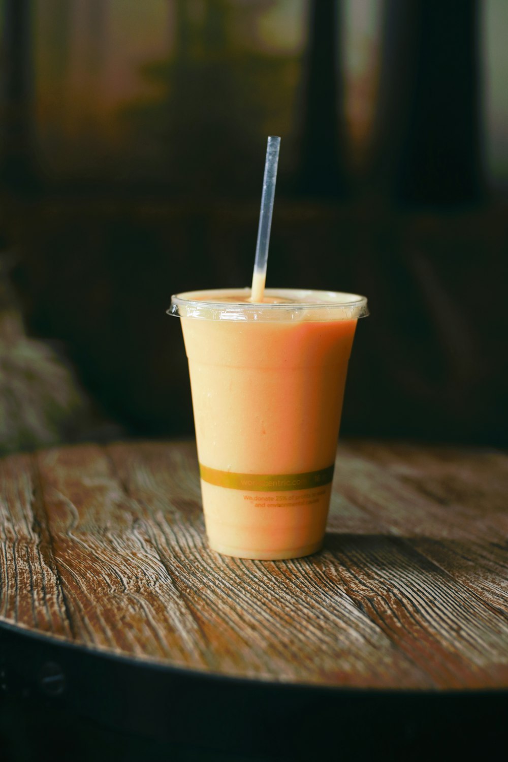 yellow and white plastic cup with white plastic straw