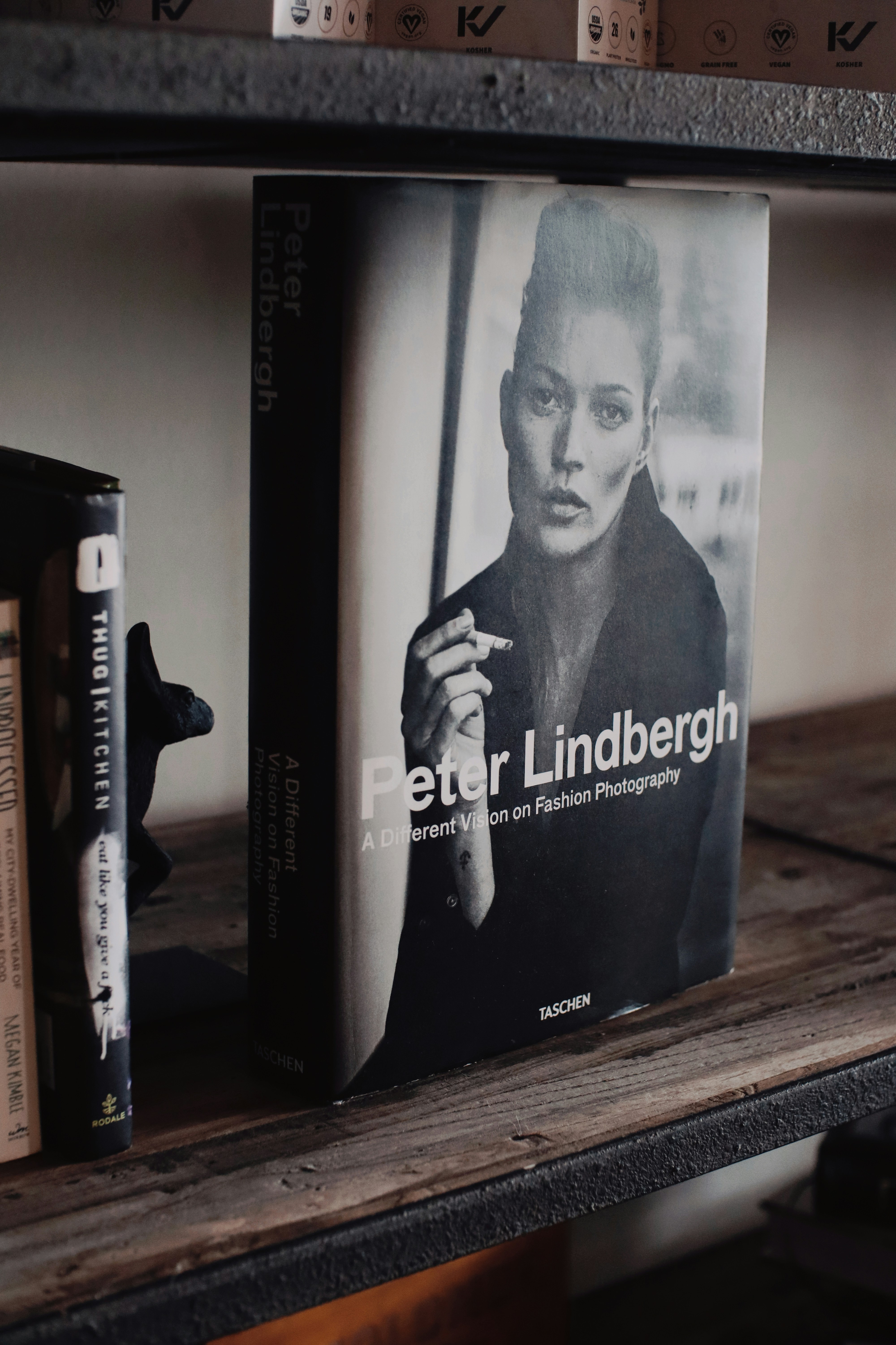 a book sitting on top of a wooden shelf