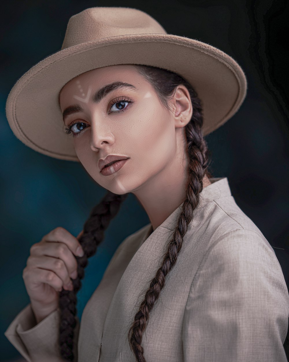 woman in white long sleeve shirt wearing brown hat