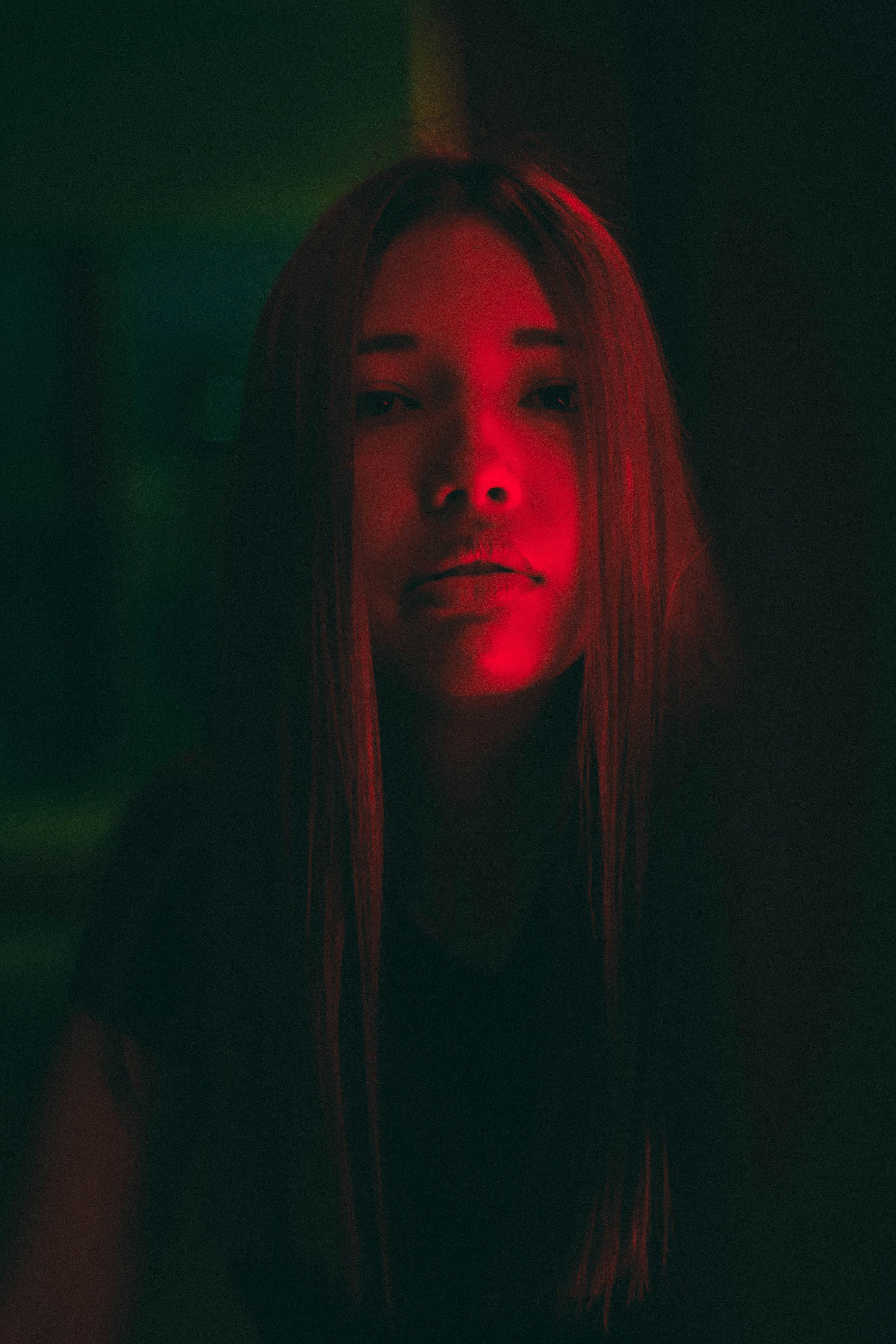 Woman With Red Hair In Dark Room Photo Free Light Image On Unsplash