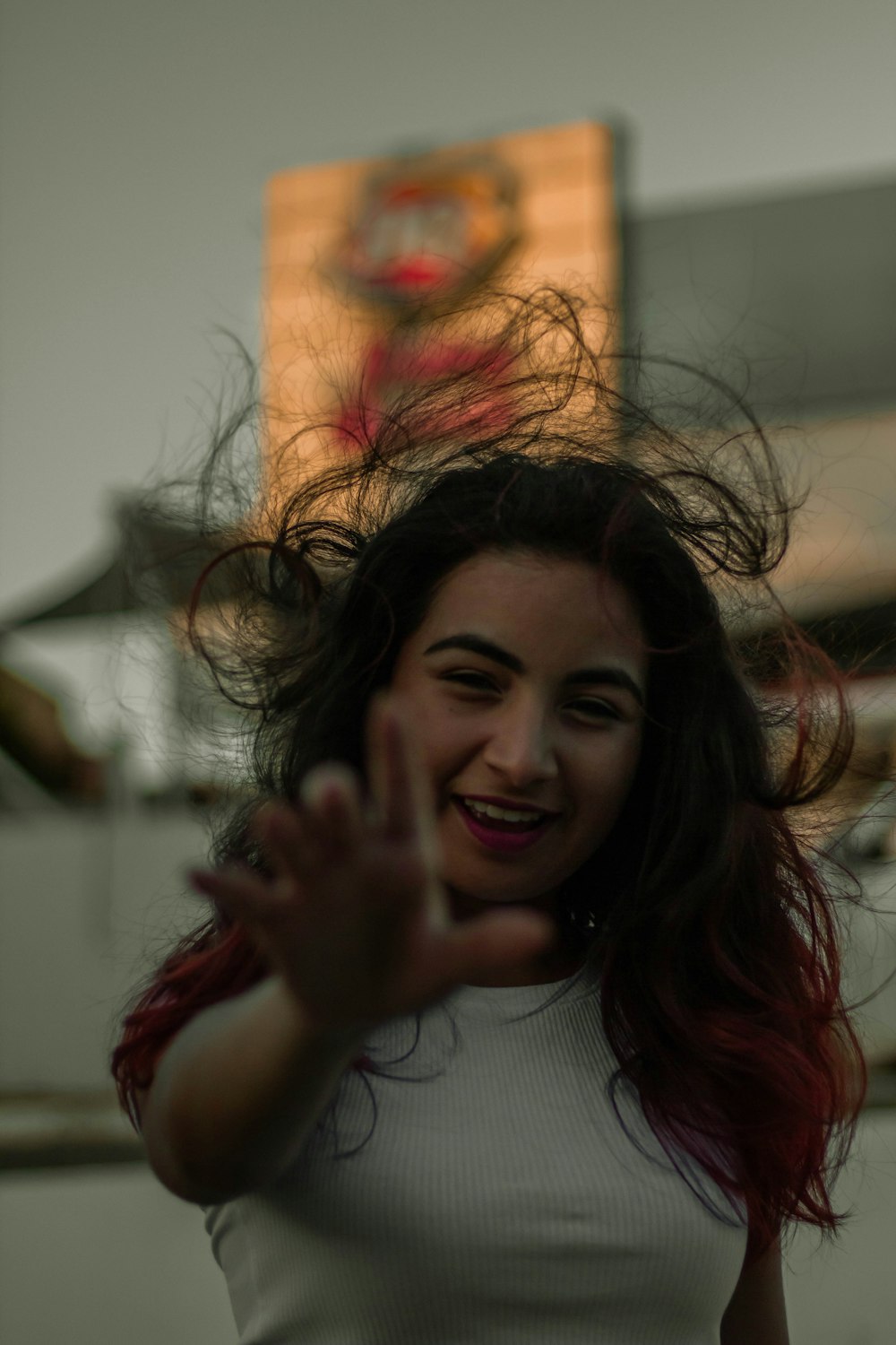 woman in white crew neck shirt smiling