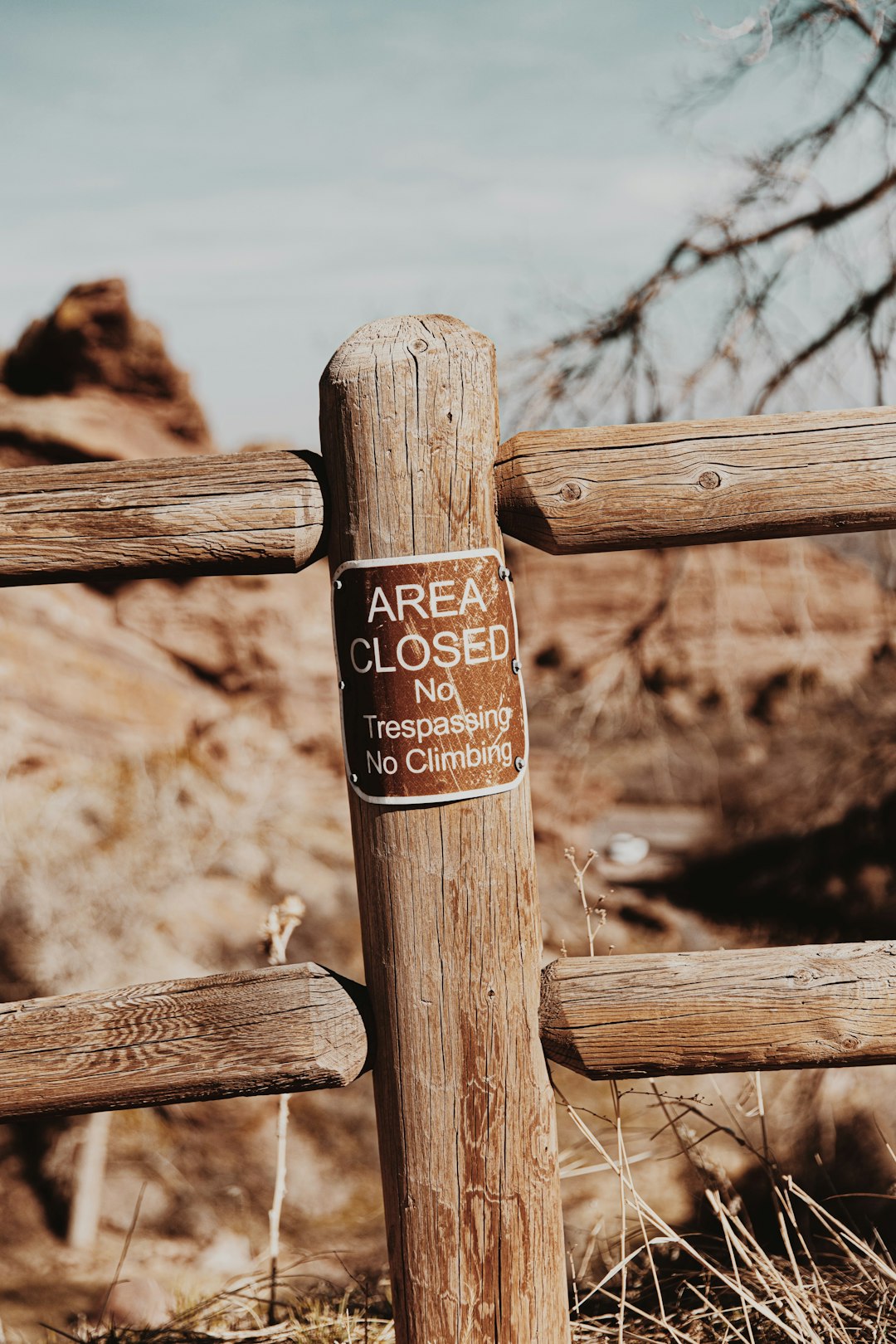 brown wooden fence with brown wooden signage