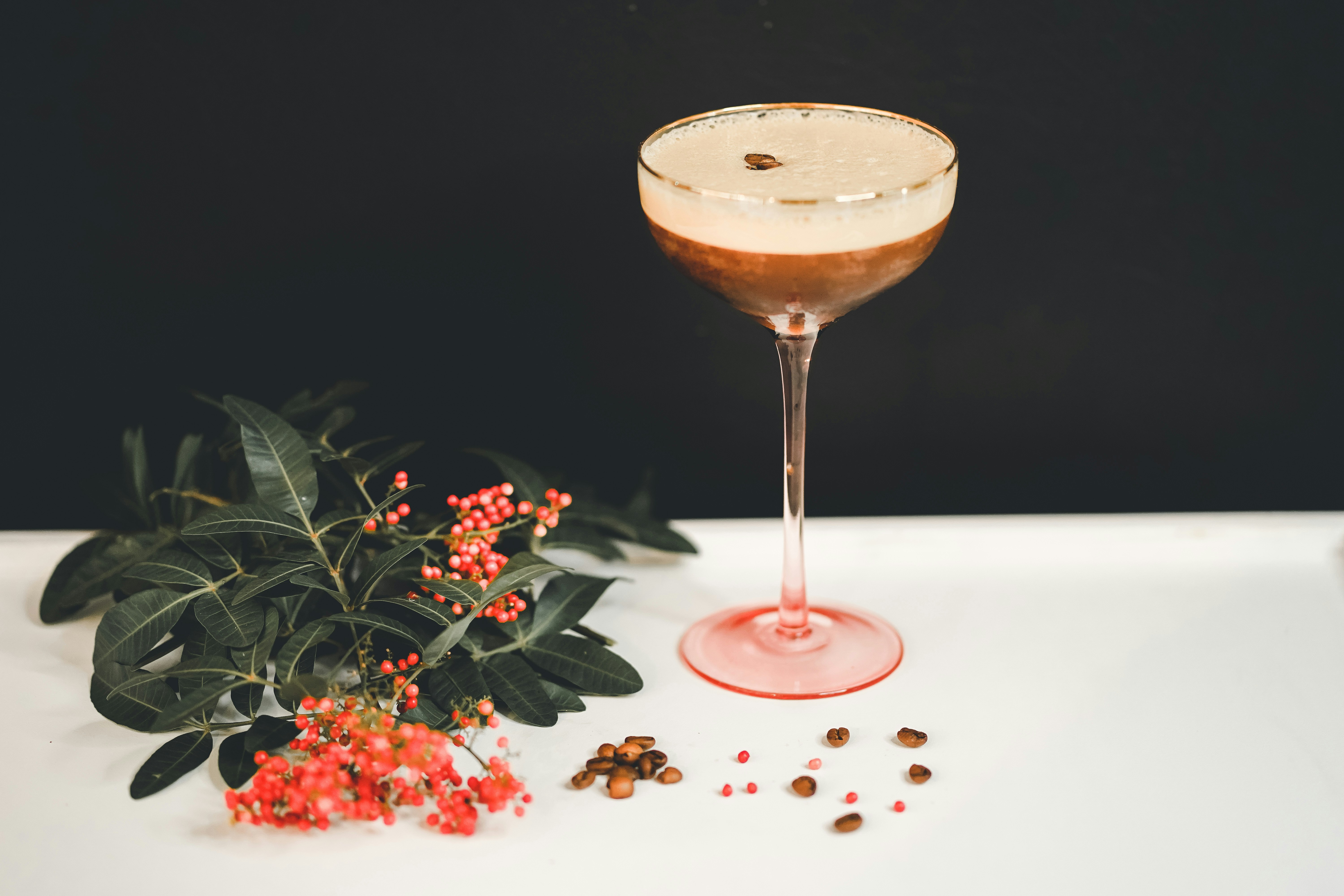 Espresso martini in a pink-stemmed coupe