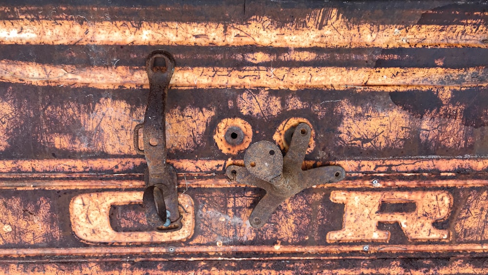 black metal door lock on brown wooden door