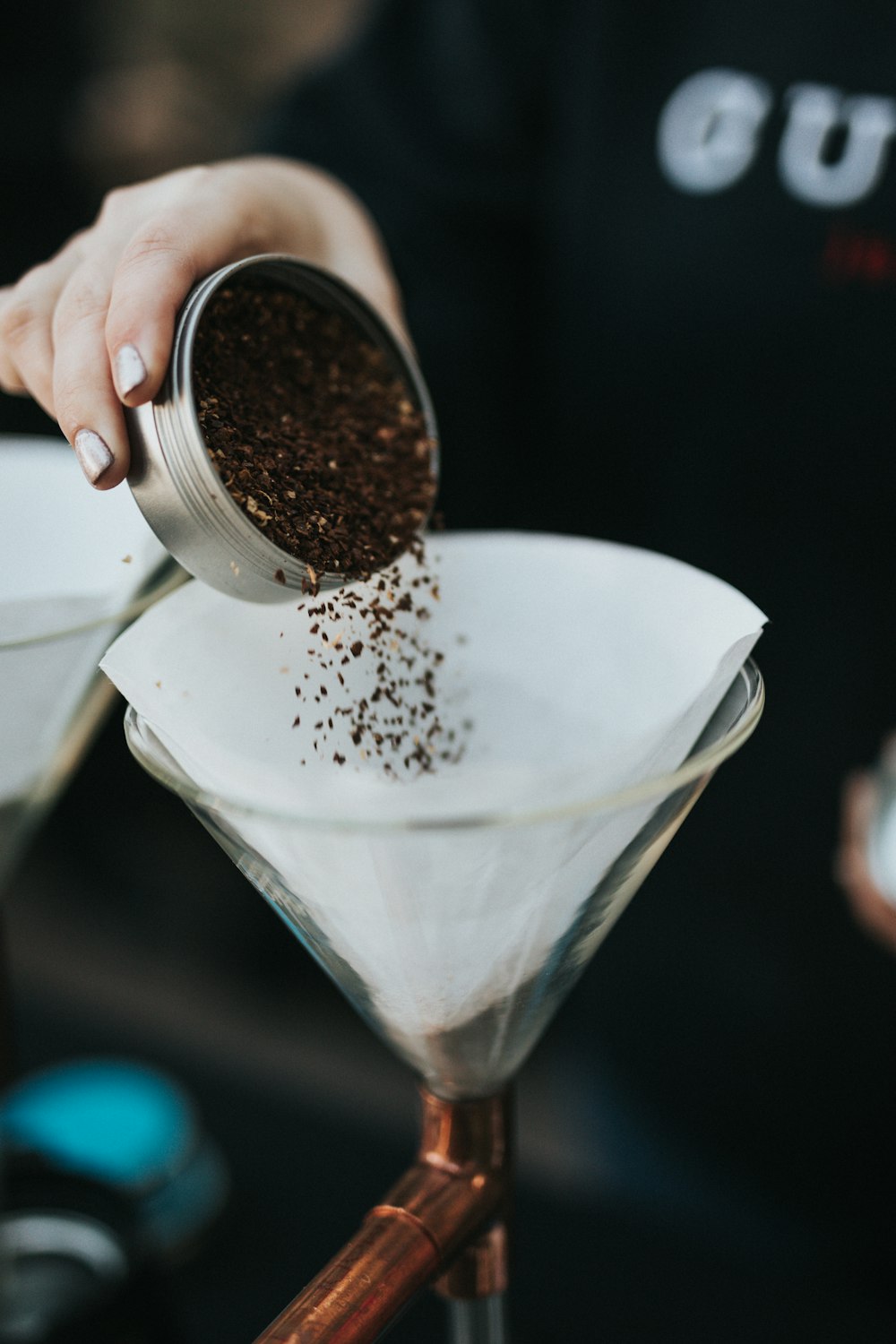 person pouring milk on clear drinking glass