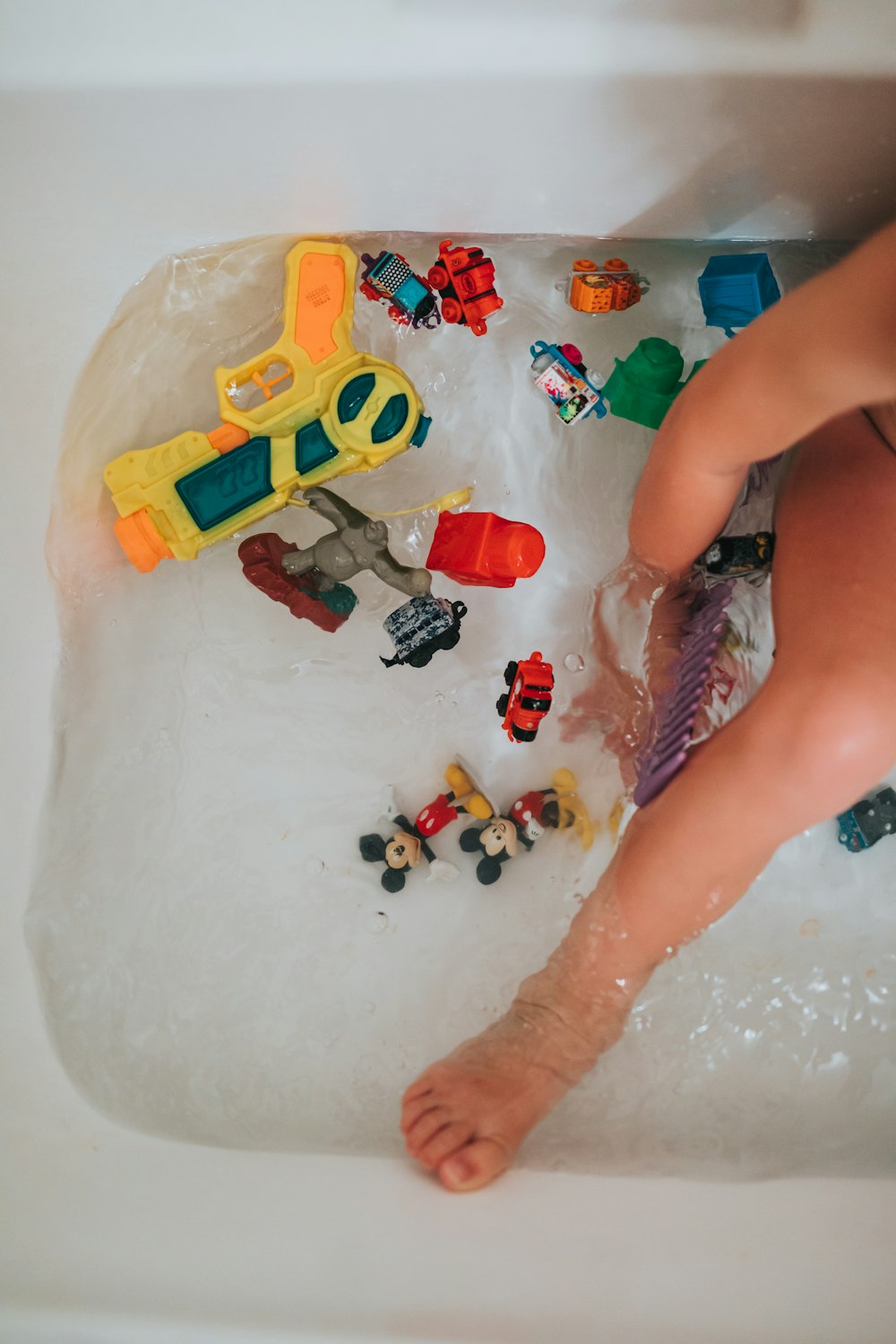 person playing with lego blocks