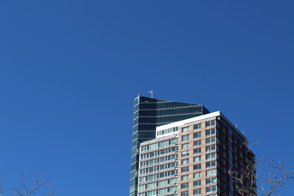 a very tall building with a sky background