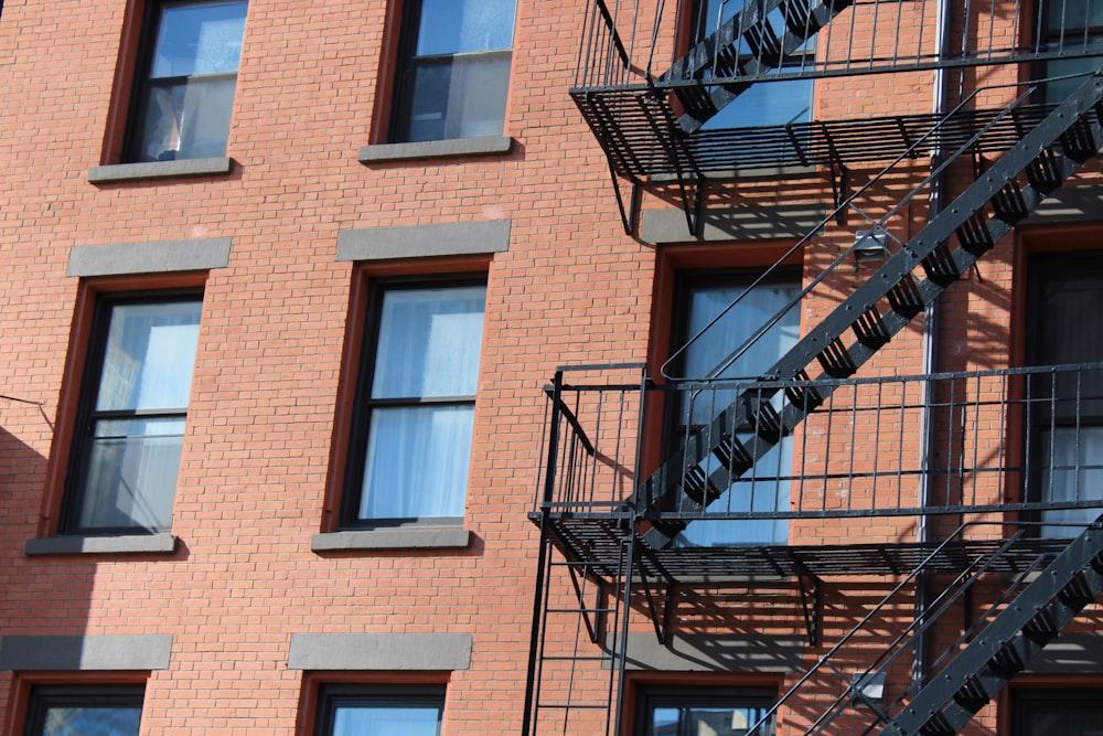 a fire escape next to a brick building