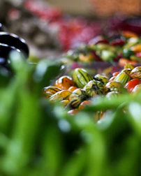 Close-up of fresh produce from a local farmer’s market arranged on a crisp parchment background.