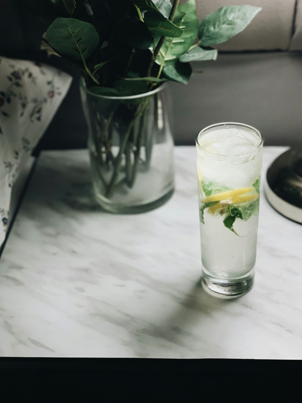 clear drinking glass with white liquid inside