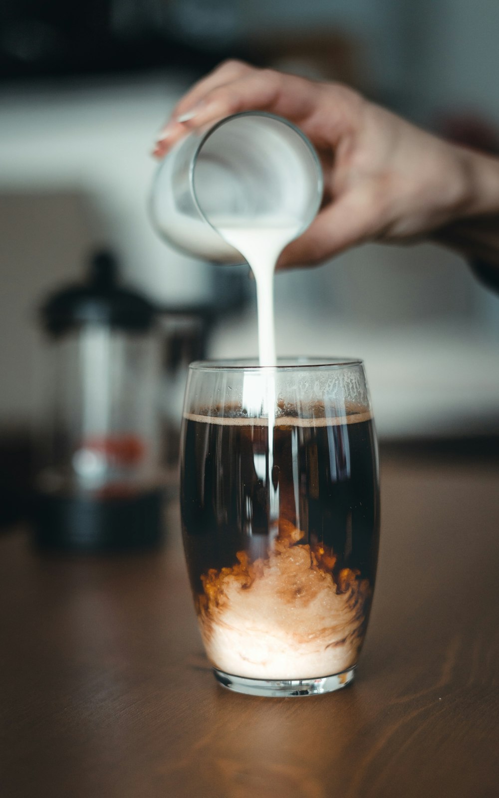 clear drinking glass with brown liquid