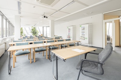 A bright and clean grooming classroom decorated in lilac and white colors.