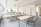 Image of a classroom with new steel furniture neatly arranged, sunlight streaming through windows.