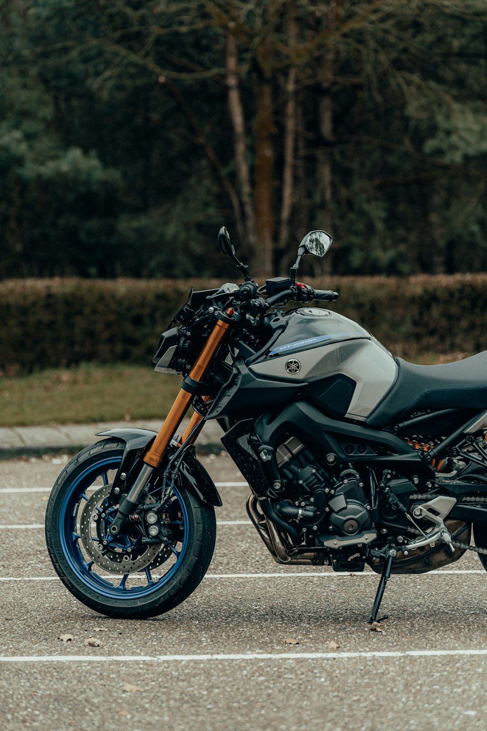 black and silver sports bike on gray asphalt road during daytime