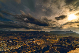 A vibrant Minecraft landscape showcasing a bustling village at sunset with players interacting.