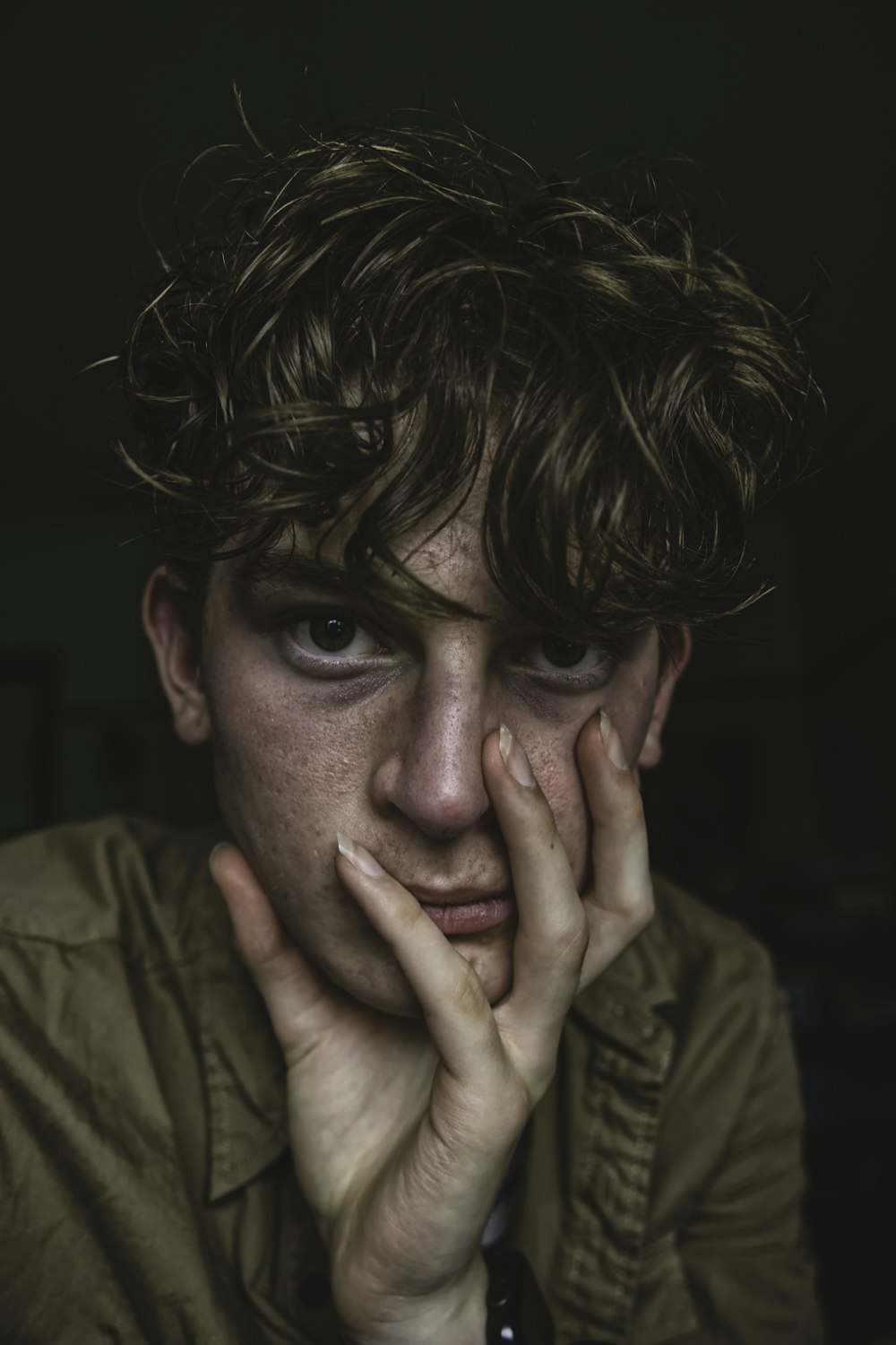 man in brown button up shirt