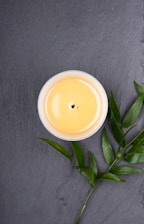 white ceramic cup with brown liquid inside