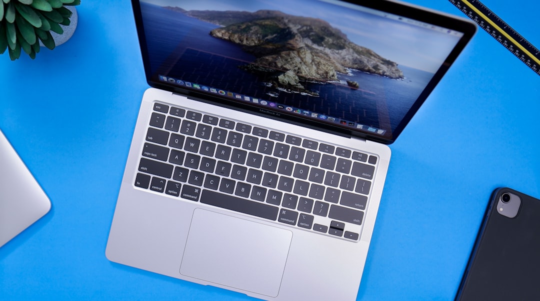 macbook pro on blue table, Apple Macbook Air 2020