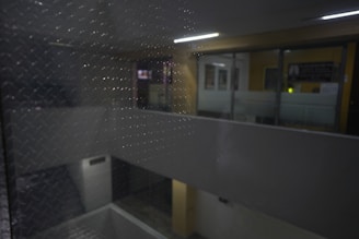 high-quality, photorealistic image of a water-damaged room being restored by skilled technicians, using industrial fans and dehumidifiers, water stains visible but controlled, clean and organized workspace, neutral or dark background, professional lighting, realistic, no text, no logos