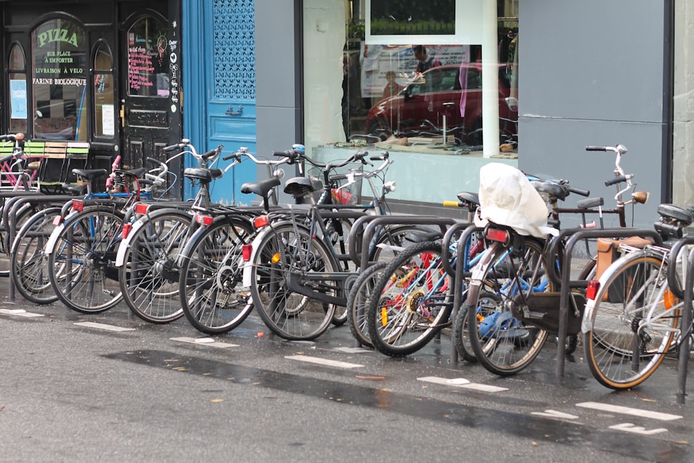 bicycles parked on sidewalk during daytime