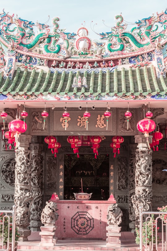 green and pink temple with pink and white wall in Kongsi Malaysia