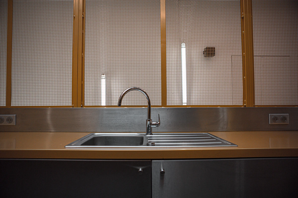 New bathroom faucet and plumbing fixture professionally installed with clean finish