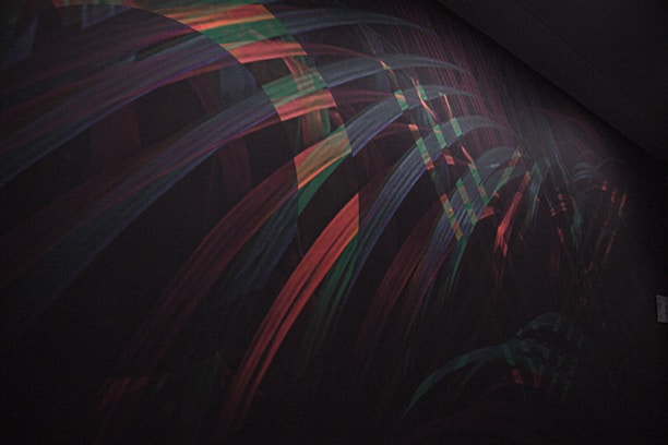 Abstract geometric data visualization with electric cyan and lime accents on a dark background.