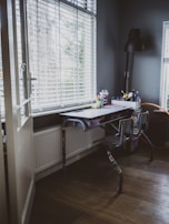 A tidy study area featuring a desk, chair, and good lighting for focused work.