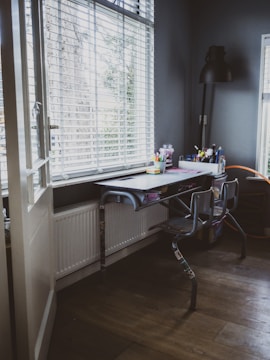A bright workspace with a functional desk and chair.