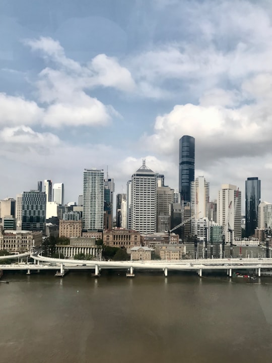 city skyline under cloudy sky during daytime in Brisbane Australia